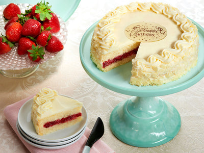 Yummy yellow cake with delicious strawberry filling and creamy mousse frosting!

