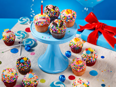 A delicious set of mini cupcakes adorned with happy birthday candies!


