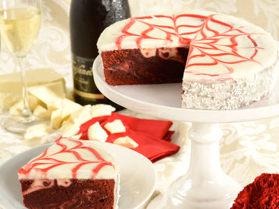 Rich, marbled, red velvet brownie cake is covered by a sophisticated and delicious icing.


